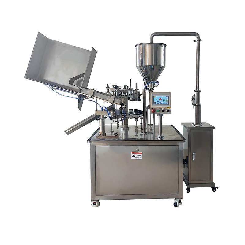 AUTOMATIC FILLING AND SEALING MACHINE